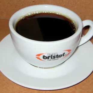 a cup of coffee on a saucer