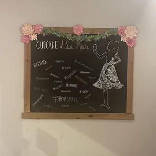 a chalkboard with a drawing of a woman