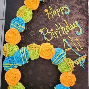 a birthday cake decorated with roses