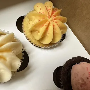 a variety of cupcakes in a box