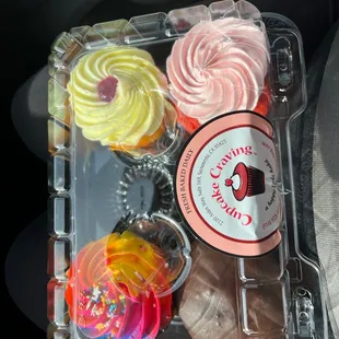 Rainbow cupcake, lemon raspberry, strawberry, and Boston crème.