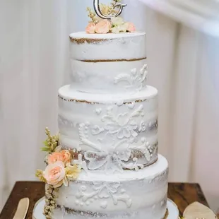 a white wedding cake with flowers
