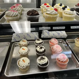 a variety of cupcakes on display