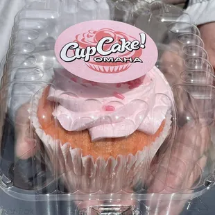 a cupcake in a plastic container