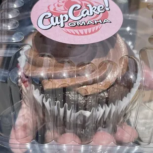 a cupcake in a plastic container