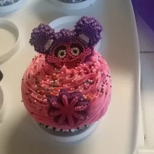 a cupcake decorated with pink frosting