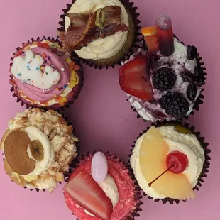 Sunday Morning, Bottomless Sangria, Uptown Bae, Strawberry Crunch Milkshake, Home Sweet Home, and Party Pebble cupcakes