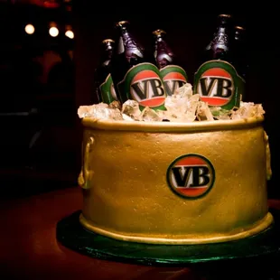 a cake with beer bottles on top