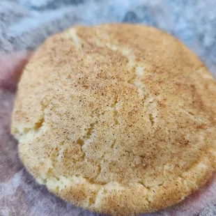 a hand holding a cookie