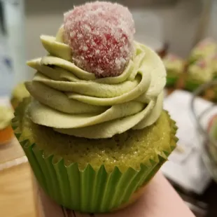 Matcha Green Tea Cupcake with a Green Tea Buttercream and Sugared Raspberry.