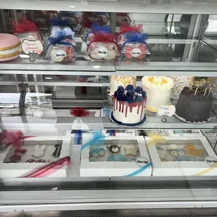 a display case filled with cupcakes