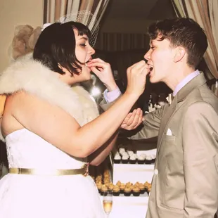 April and Jenny enjoying a cupcake on their wedding day!