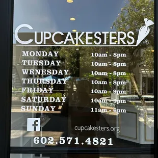 the front window of a cupcake shop