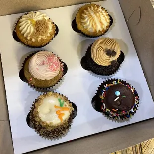 Six cupcakes in a variety of flavors