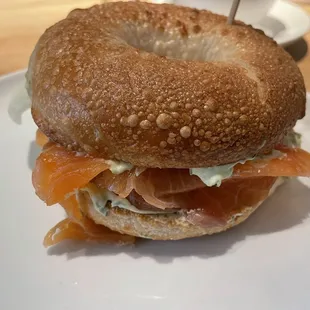 House-cured Salmon, Herb cream cheese, Cucumber, Bagel Wholewheat, Sesame.