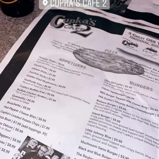 a menu and a bottle of beer