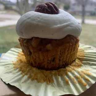 a cupcake on a paper plate