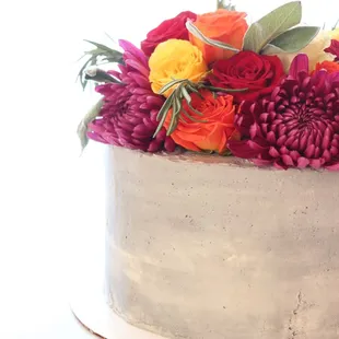 Custom made concrete cake with fresh flowers and herbs