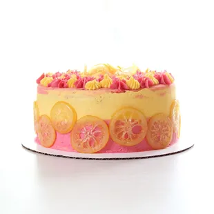 Custom cake order: Lemon cake with raspberry filling, lemon and raspberry buttercream, and decorated with candied lemons