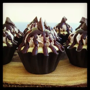 chocolate and white frosting on a wooden board