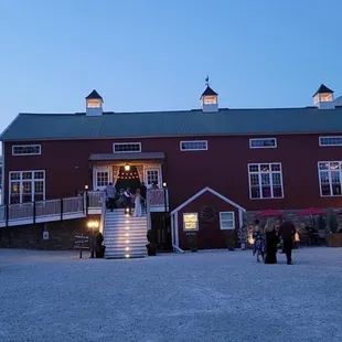 Dusk view view of the barn exterior.