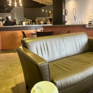 a couch and coffee cup
