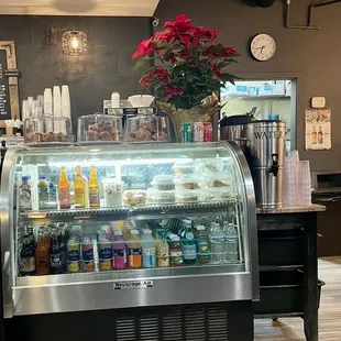 a coffee shop with a display of beverages