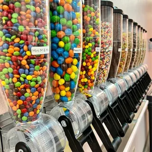 a row of candy dispensers