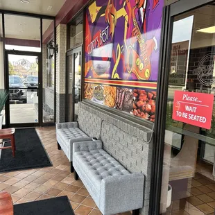 The entrance door is separate from where the dining is actually at so the cold air does not bother you as you dine. Genius and stylish too.