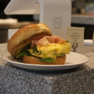 a breakfast sandwich on a plate