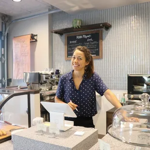 a woman behind the counter