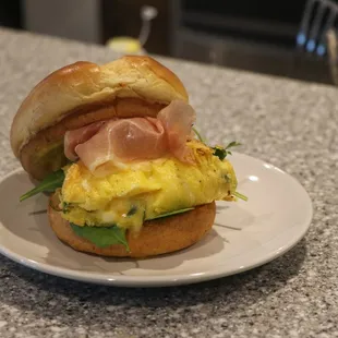 a breakfast sandwich on a plate
