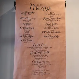 a menu hanging on a wall