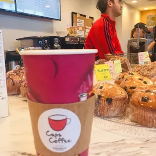 a cup of coffee and muffins