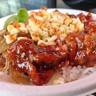 Sweet Spicy fried chicken gangjung, with white rice, rice noodles, corn, egg and greens, topped with the very spicy buldak sauce..