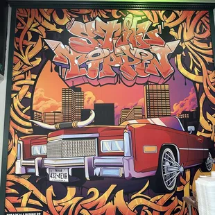 a mural of a red car