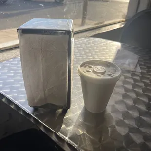 This is considered a small drink for $2. The napkin dispenser next to it for reference only. You do get free refills.