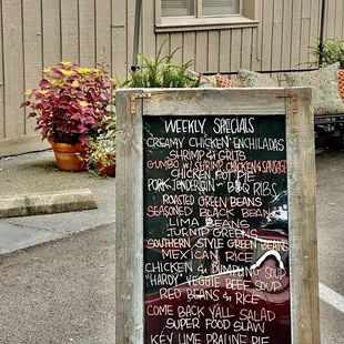 a menu on a sidewalk