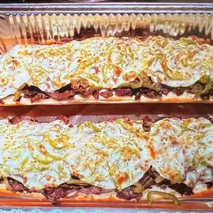 two sub sandwiches in a pan