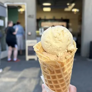 Lemon cream and butter pecan ice cream with waffle cone