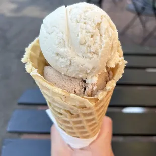 Lemon cream and butter pecan ice cream with waffle cone