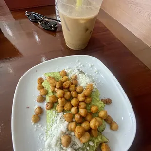 Avocado toast with chickpeas and feta cheese and a chagaccino (mushroom coffee)