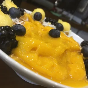 Mongo bowl with blueberries, coconut and pineapple