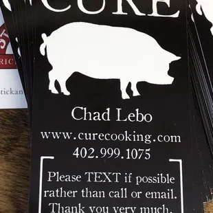 a bunch of business cards on a table