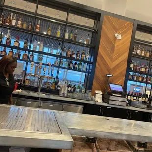 a man sitting at a bar in a restaurant