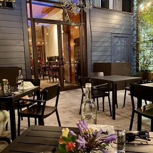 a dining area with tables and chairs