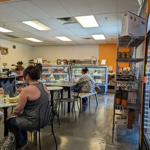 a group of people sitting at a table eating