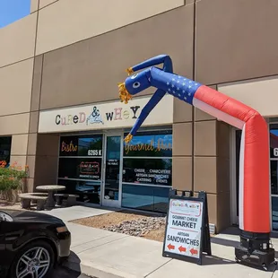 an inflatable fire hydrant in front of a store