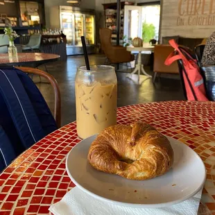 Iced white chocolate latte and plain croissant
