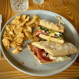 Hot Italian sandwich with chips at Cured. on Columbia.